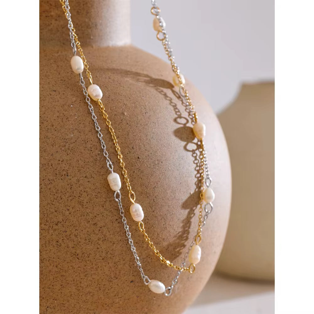 Premium stainless steel necklace with freshwater pearls finished with 18k gold plating
